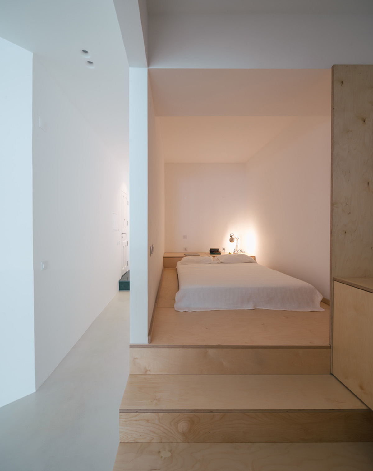 Verum Atelier redesigns old apartment with light-filled and airy interior space in Lisbon, Portugal