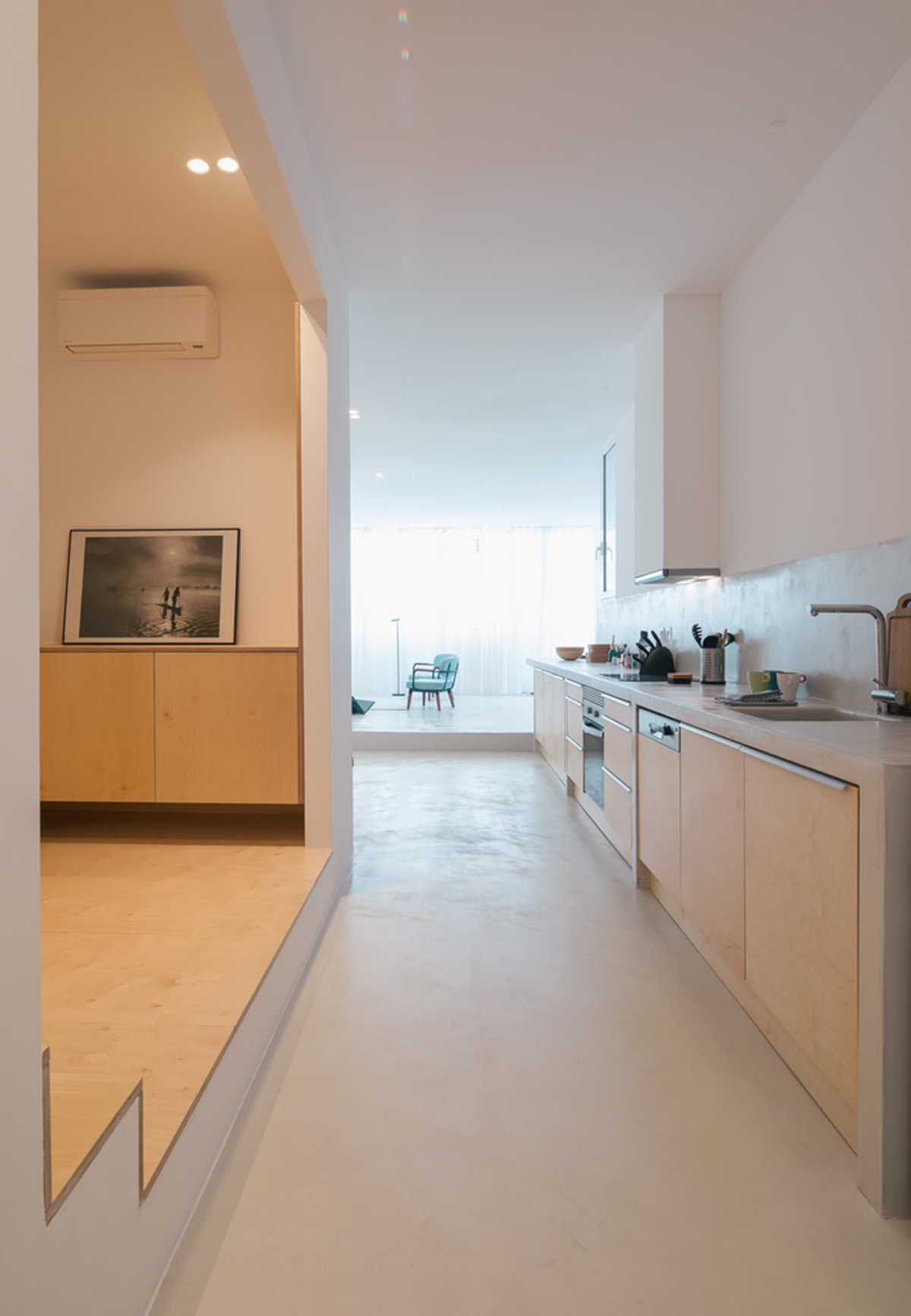 Verum Atelier redesigns old apartment with light-filled and airy interior space in Lisbon, Portugal