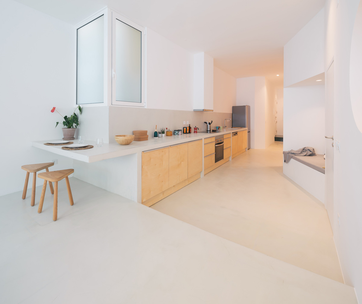 Verum Atelier redesigns old apartment with light-filled and airy interior space in Lisbon, Portugal