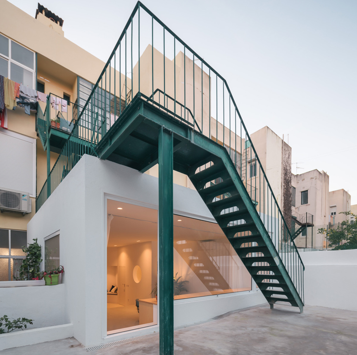 Verum Atelier redesigns old apartment with light-filled and airy interior space in Lisbon, Portugal