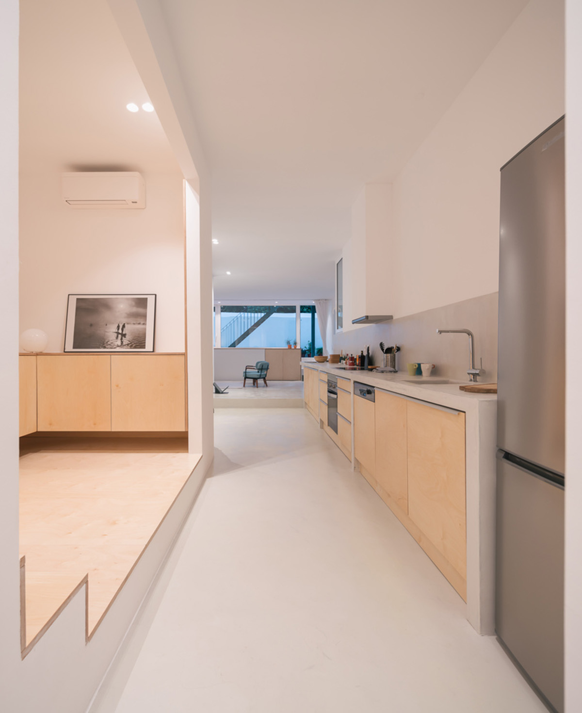 Verum Atelier redesigns old apartment with light-filled and airy interior space in Lisbon, Portugal