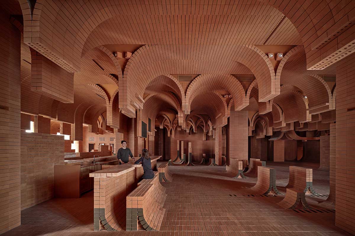One Plus Partnership adds layered bricks to a cinema interior to resemble waves in Haikou
