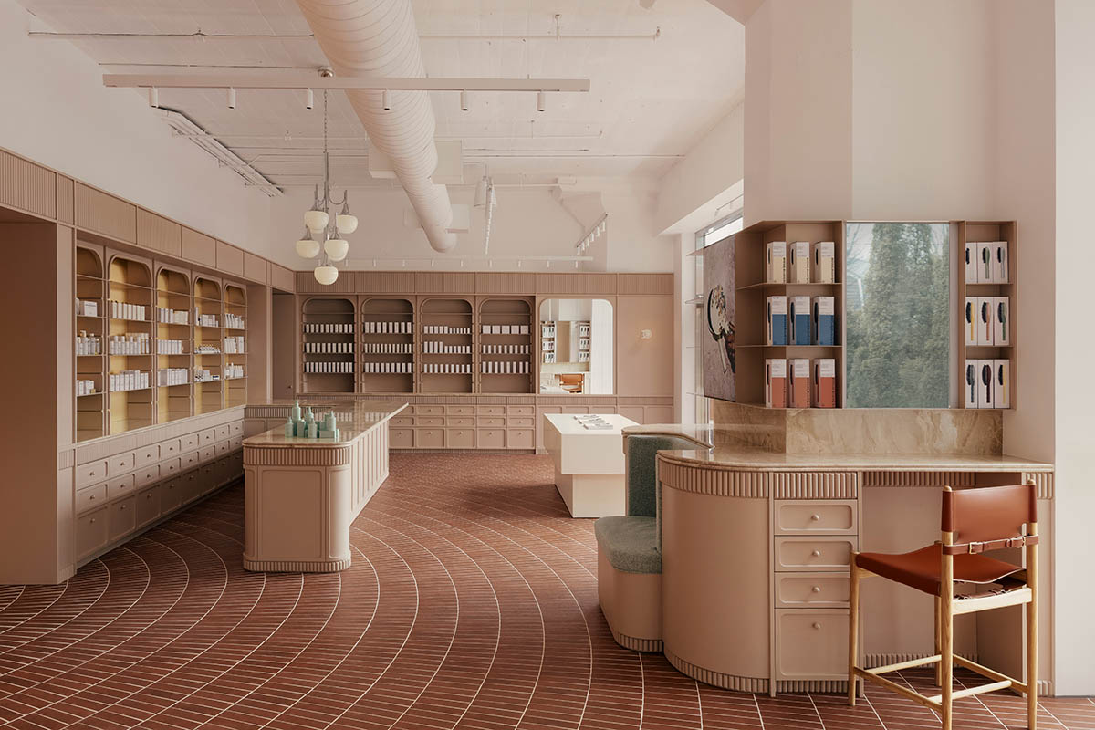 Odami enriches the interiors of a beauty shop with rounded, bevelled details, and pinkish hues