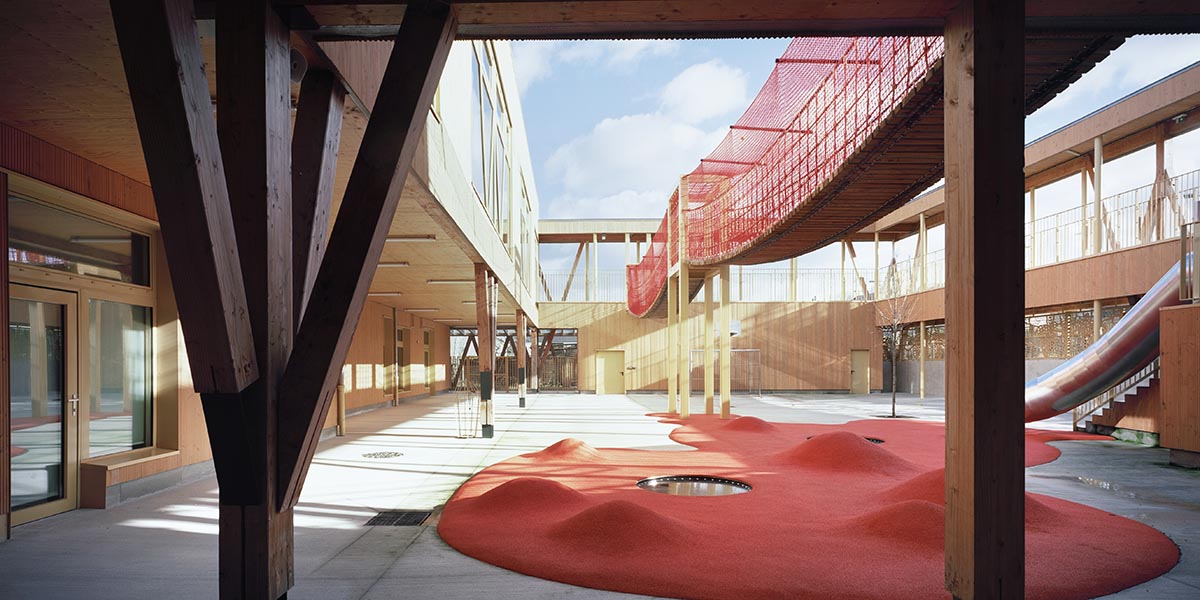 Wooden school by r2k architecte is inspired by Nordic architecture to be a positive energy building