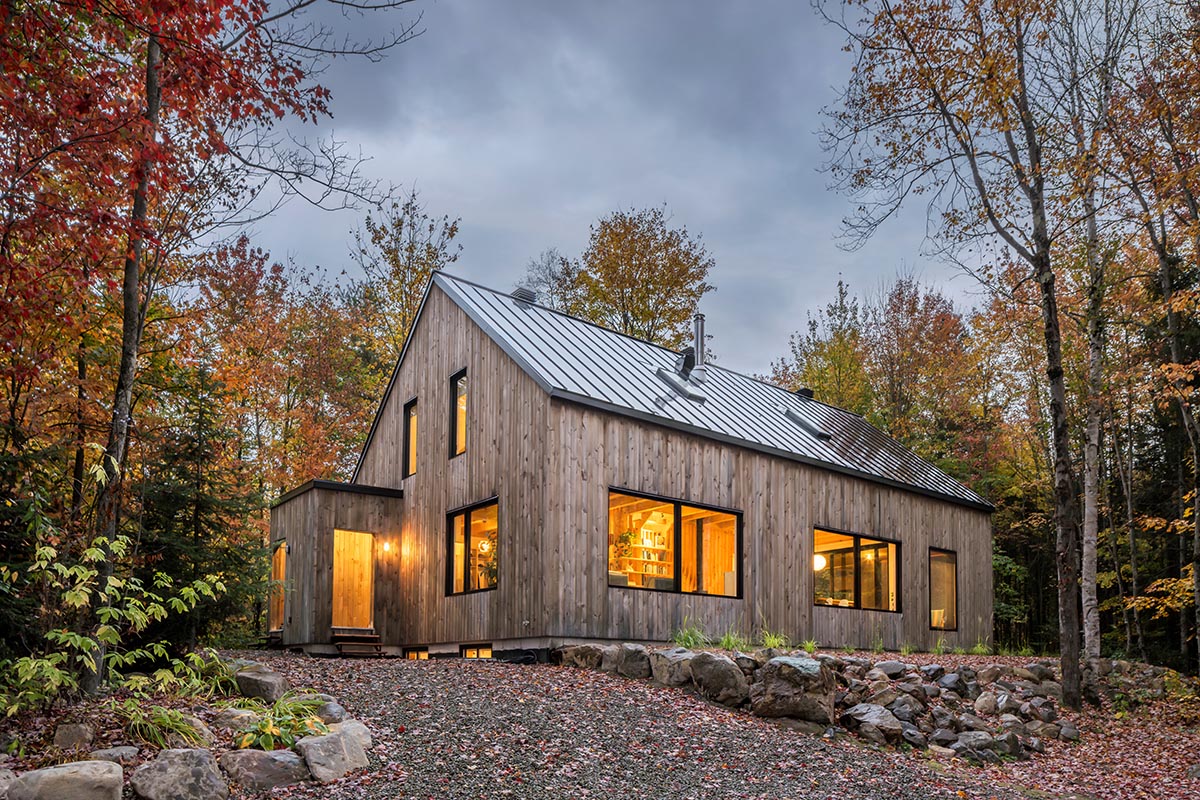 Country home is a wooden shelter that brings tranquility in the heart of the forest in Canada