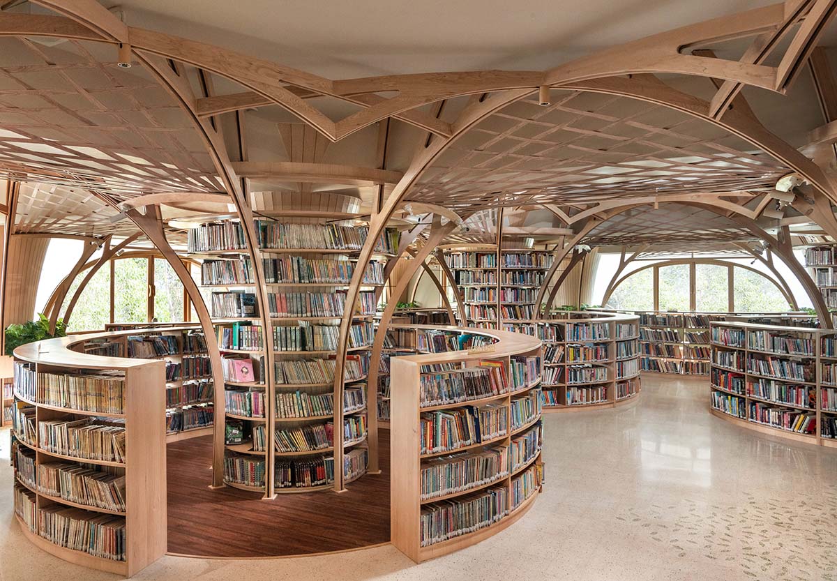 studio Hinge embeds a library under the wooden tree-like canopies in Mumbai