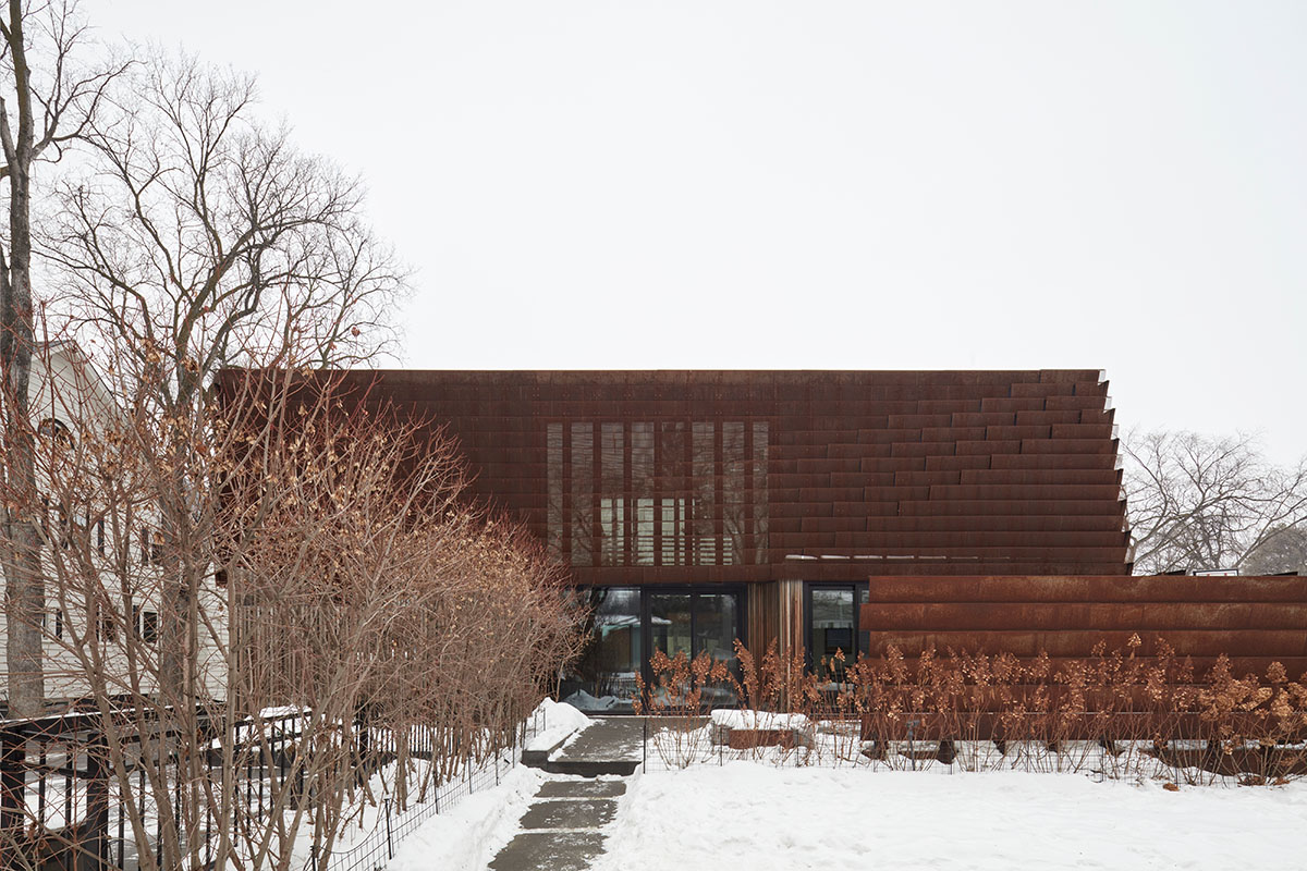 Weathered steel weil wraps the façade of Veil House in to resist snowfalls in Winnipeg