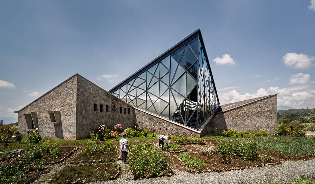 Striking geometric glass geometry resembles an open eye at a distillery in Rwanda