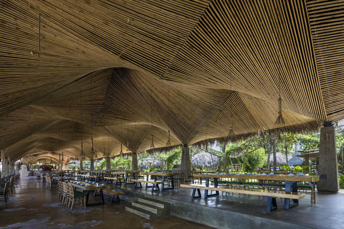 DDconcept Architecture uses coconut leaves and bamboo to create undulating restaurant in Vietnam