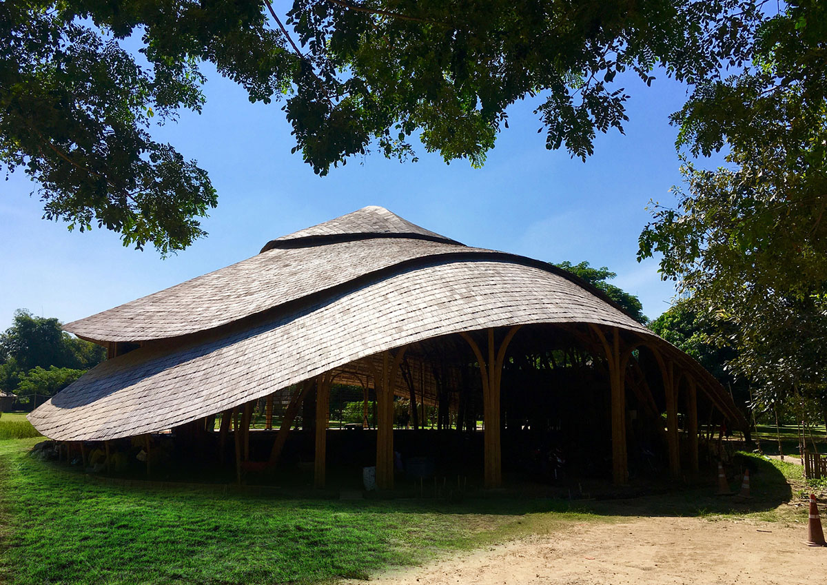 CLA used organic flowing curves with newly invented bamboo trusses for Bamboo Sports Hall in Thailand