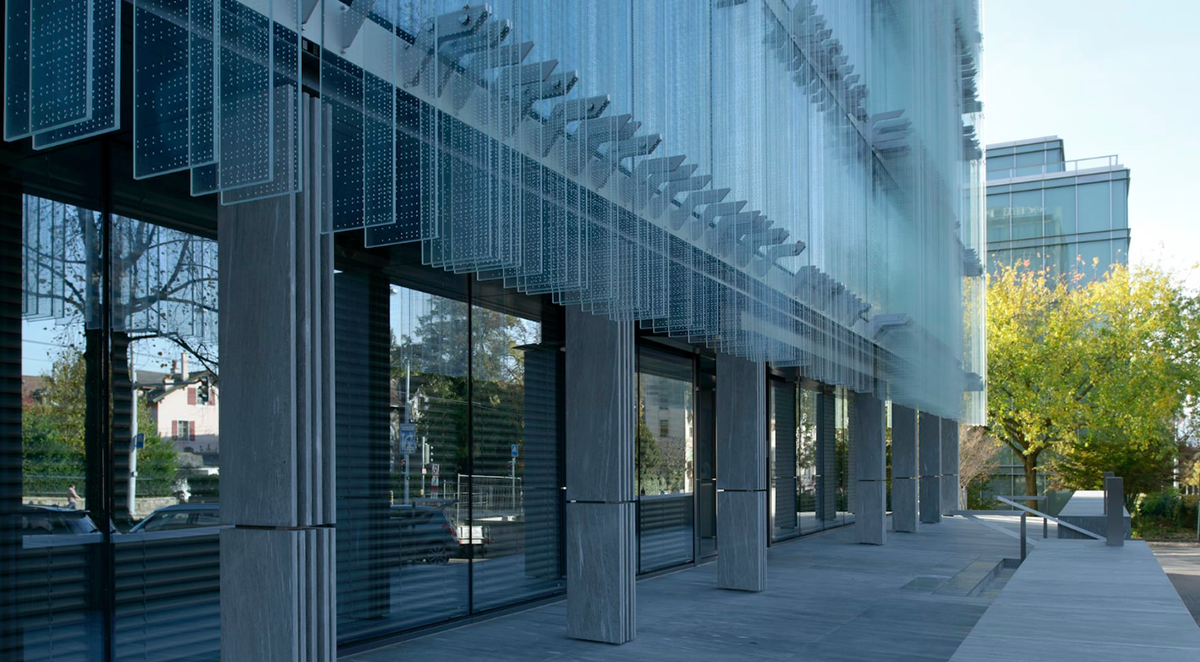 Giovanni Vaccarini wraps SPG Headquarters with countless glass fins, placed  perpendicular to facade