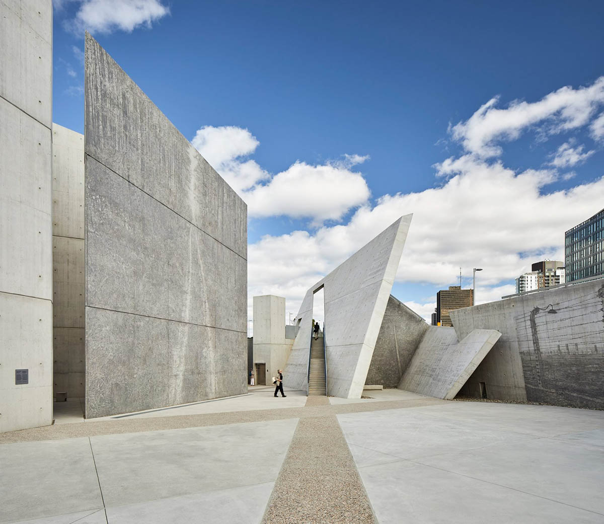 Daniel Libeskind’s Holocaust Monument features fragmented concrete walls creating rough landscape