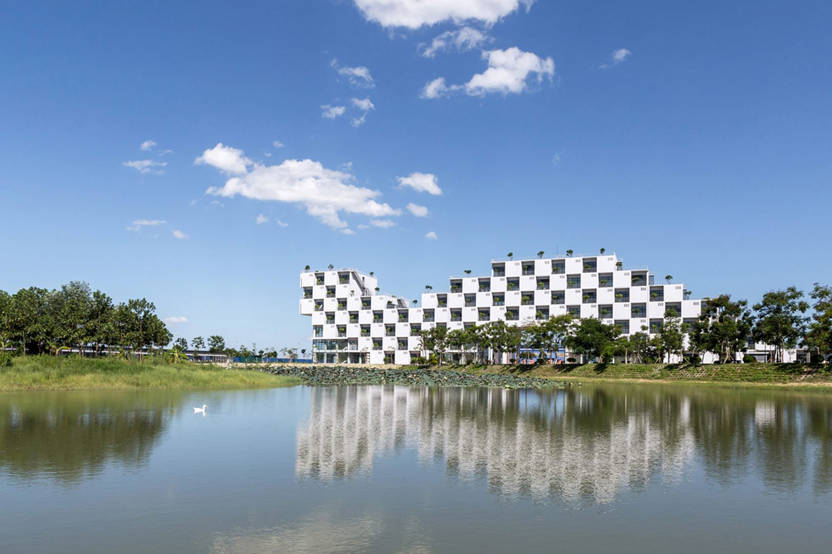 VTN Architects brings nature into the checkerboard fa&ccedil;ade of Hanoi university building