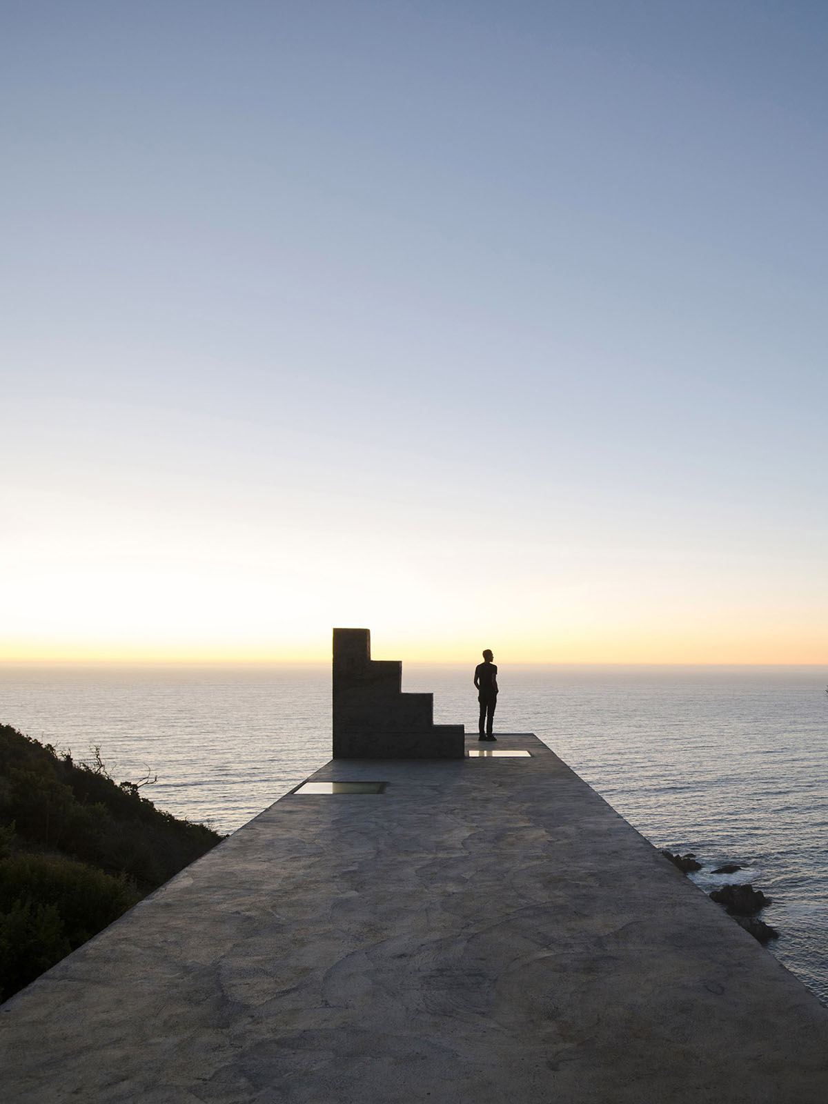 Pezo von Ellrichshausen anchors this concrete block to a cliff of Chile's Coliumo Peninsula