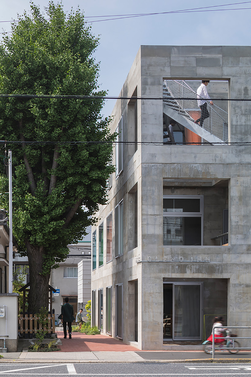 Tato Architects creates painted effect to this concrete hotel by using colourful curtains in Osaka