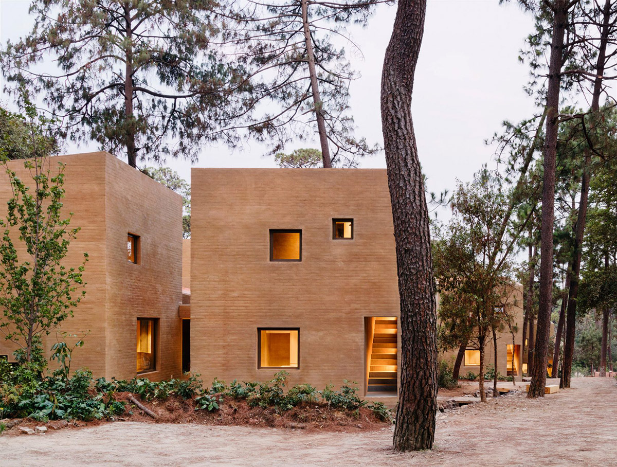 Taller Hector Barroso built five weekend houses from red-coloured terra-cotta in Mexican forest