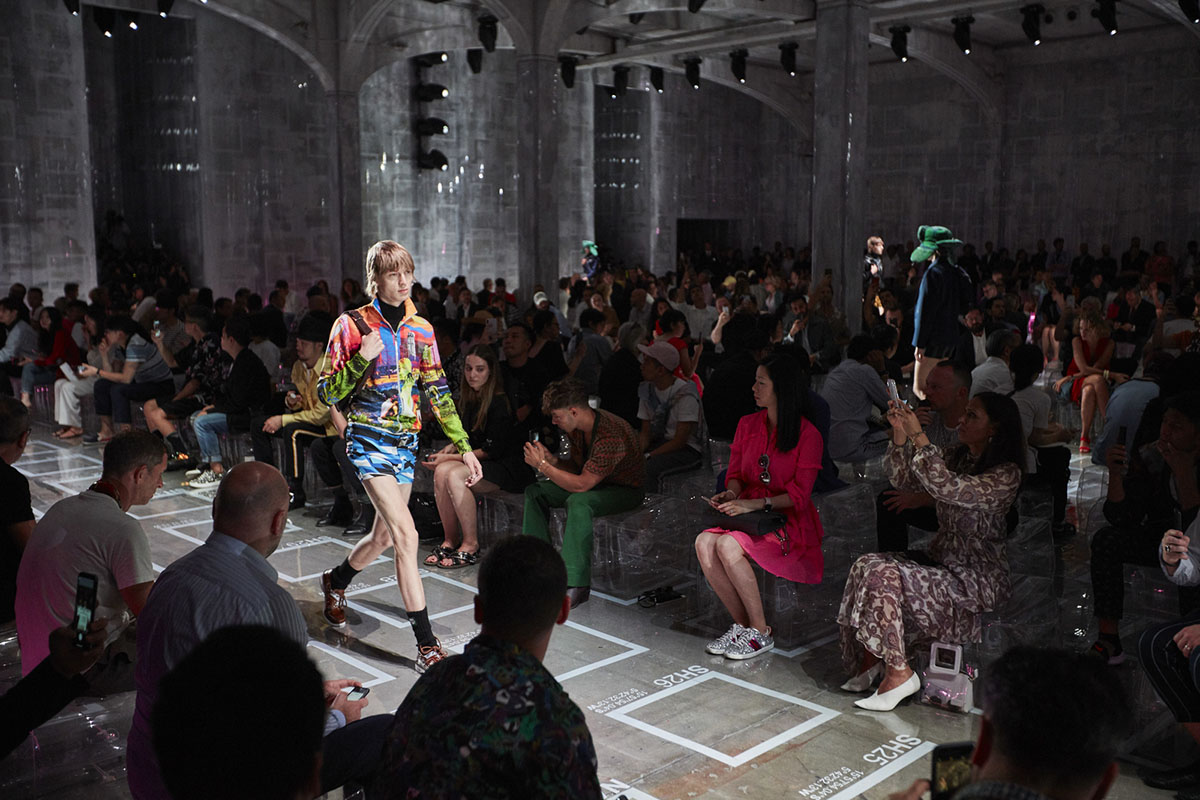 AMO filled Prada's fashion show stage with purple-lit inflatable stools