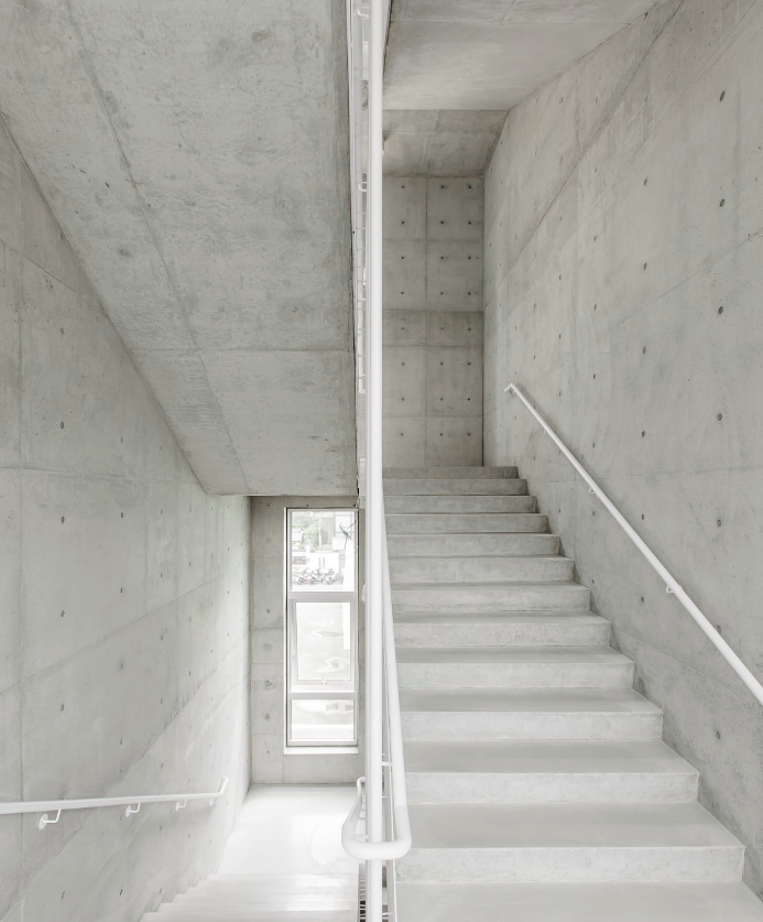 MAYU architects+ adds copper-coloured featherlike screen to main facade of Tung-Men Holiness Church