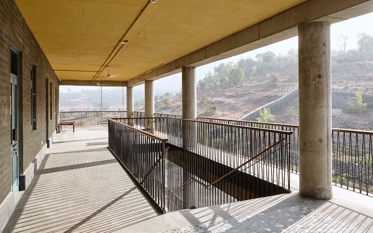 Avasara Academy, resembling an unfinished structure, educates young women in the moorland of Pune