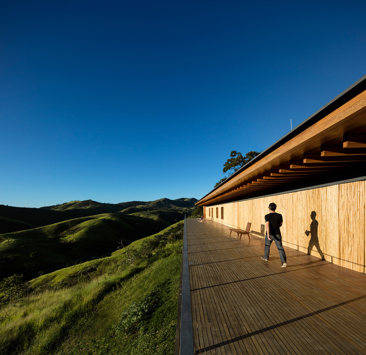 Narrow wooden Catu&ccedil;aba House by Studio MK27 produces its own energy on a valley of S&atilde;o Paulo