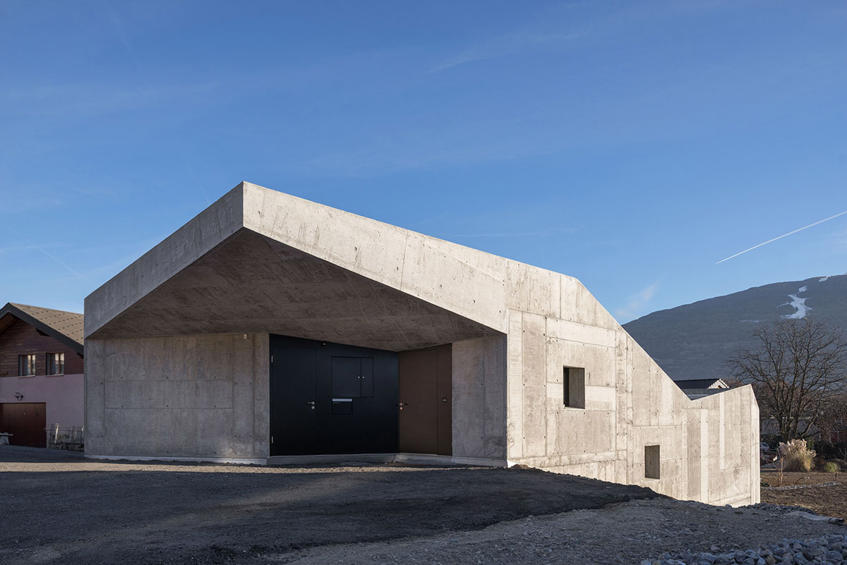 Anako Architecture completes slopped concrete residence in Switzerland