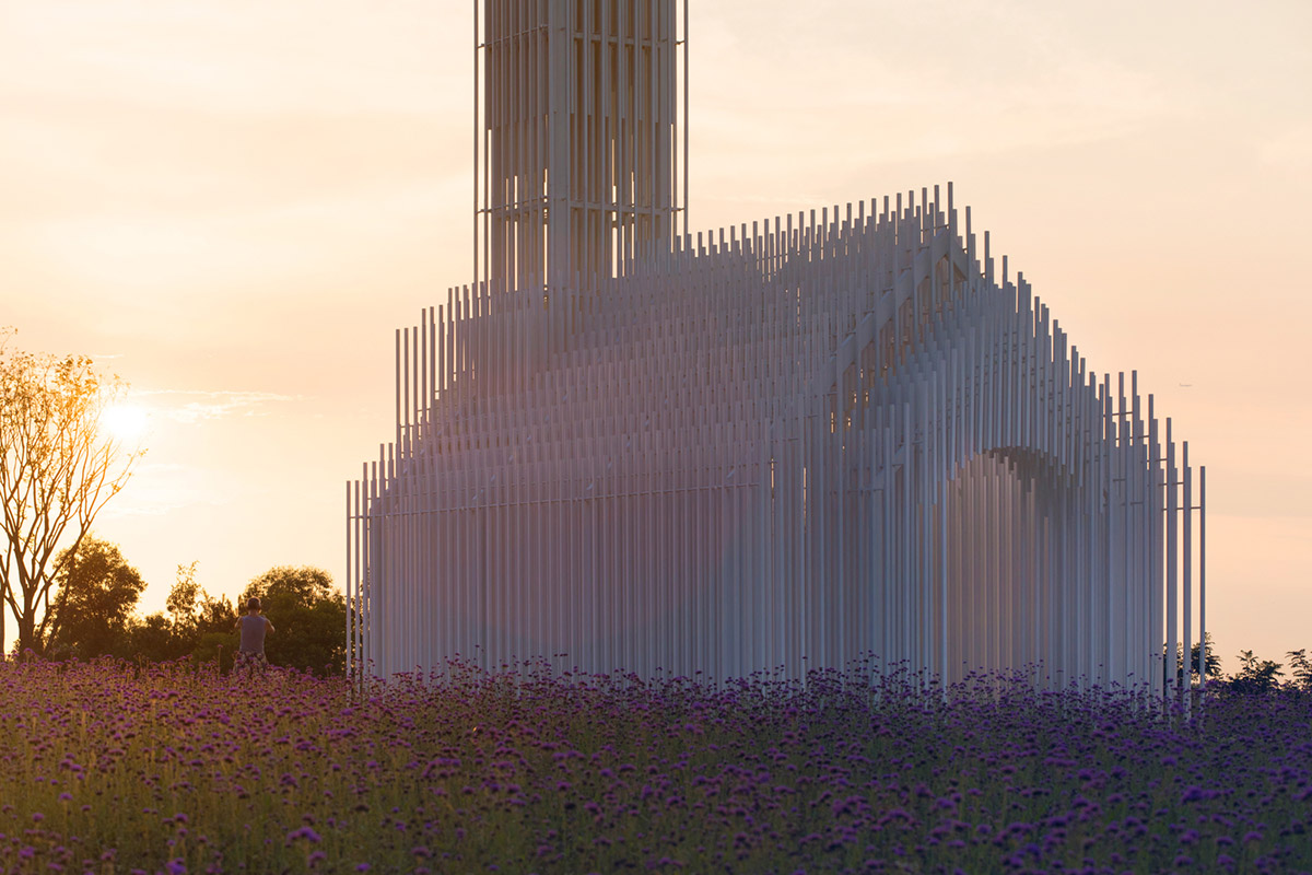 A church made of thousands of white thin beams looks like suspended in the air in lavender field