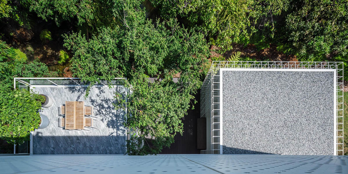 AAd built self-sustainable residence with perforated facade and steel rods in Thailand