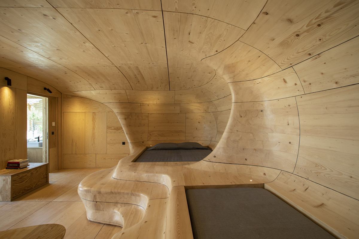 Tenon Architecture creates cave-like wooden interior for a resort in Greece