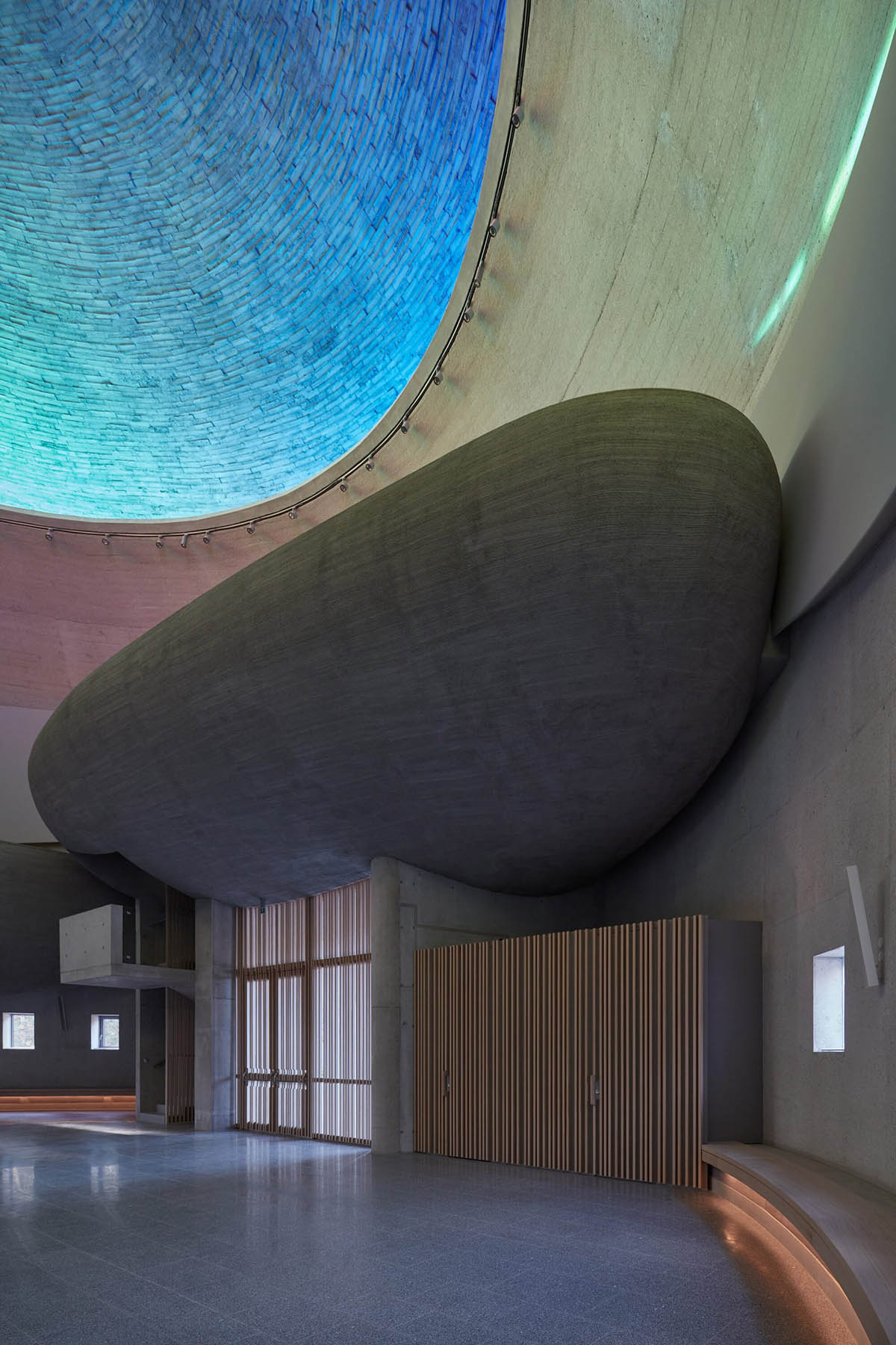 Atelier Štěpán designs Church of Beatified Restituta that features a circular rainbow window in Brno