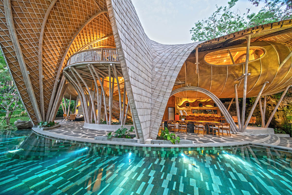 Undulating bamboo roofs wrap this wellness retreat in a lush forest of Bali