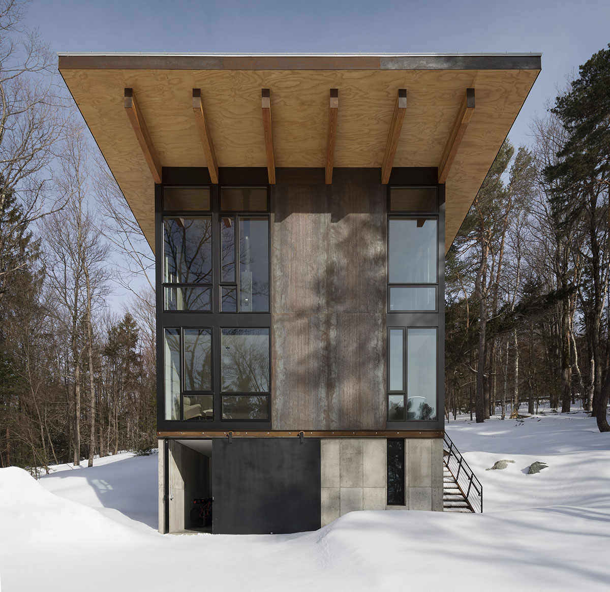 Olson Kundig creates compact and minimal family cabin in a heavily ...