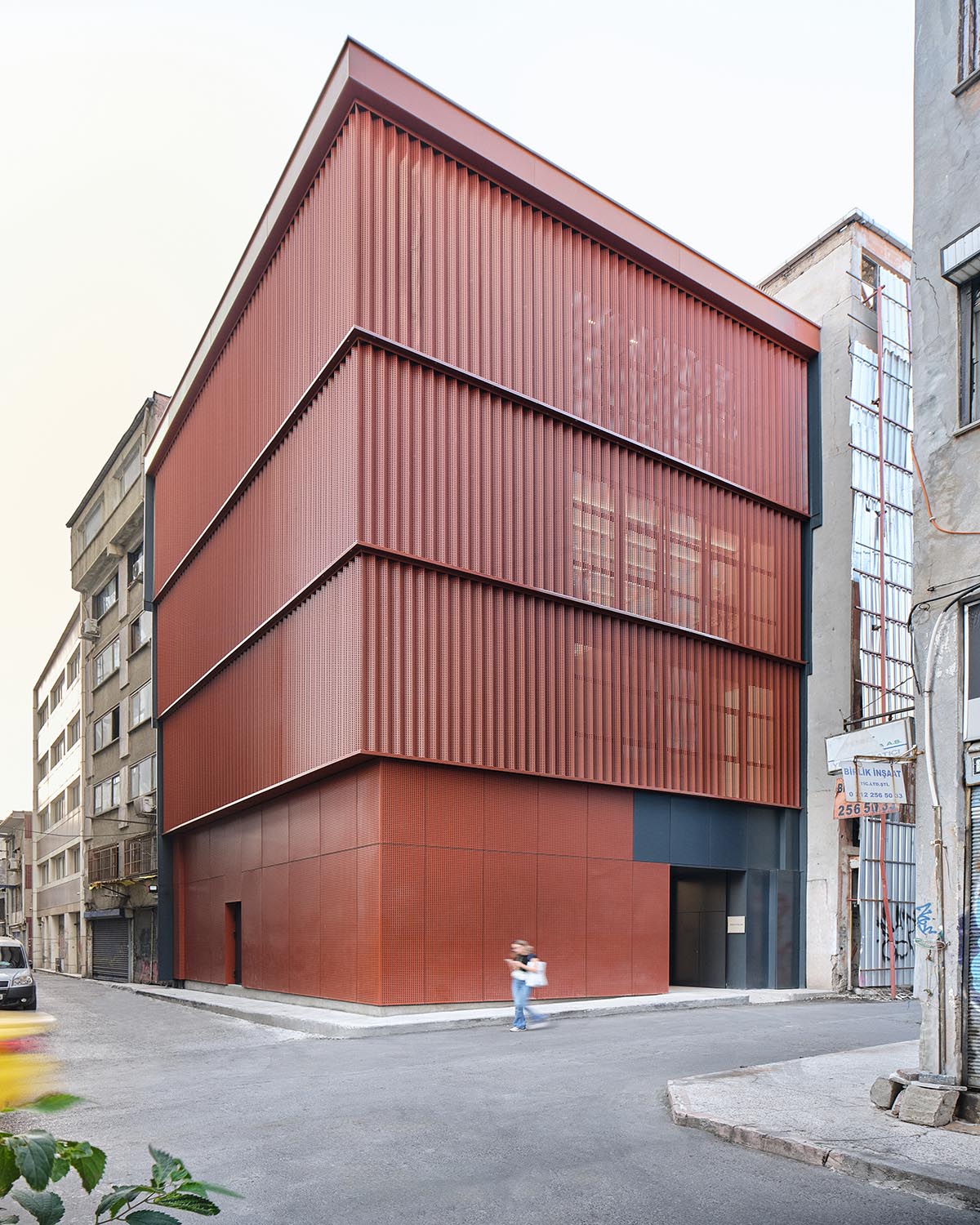 Nevzat Sayin wraps art gallery with a reddish brown façade in a historic district of Istanbul