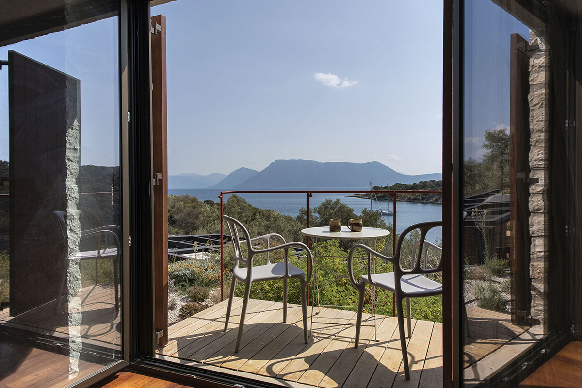 Pastoral round stone dwellings inform Meganisi House by Hiboux Architecture on Meganisi island