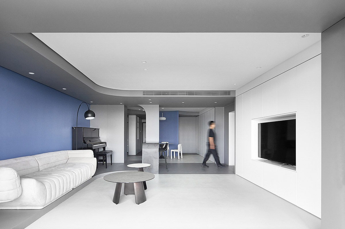 XIGO STUDIO creates gray and blue-colored interiors for apartment in Beijing 