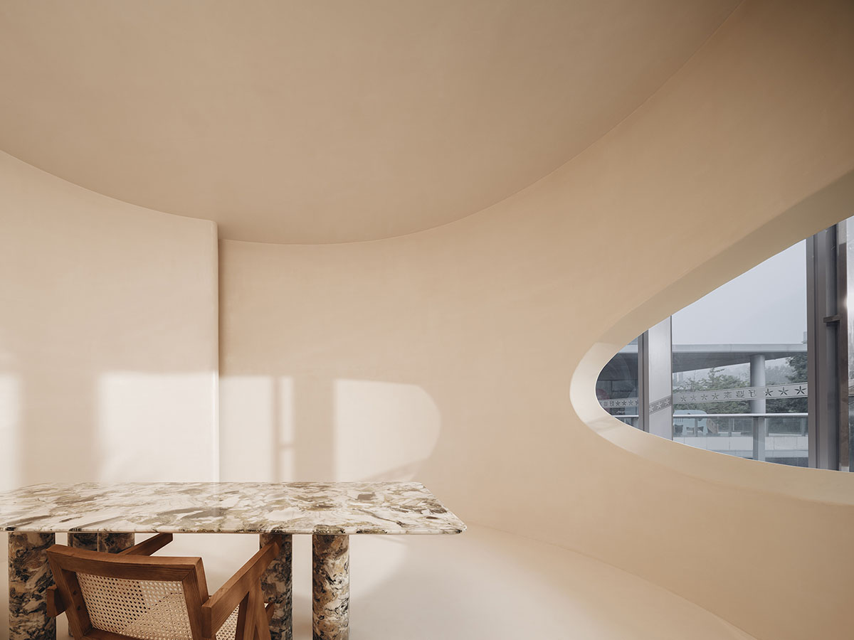 Undulating and smooth walls form this retail store by Panda NANA in Jinan, China