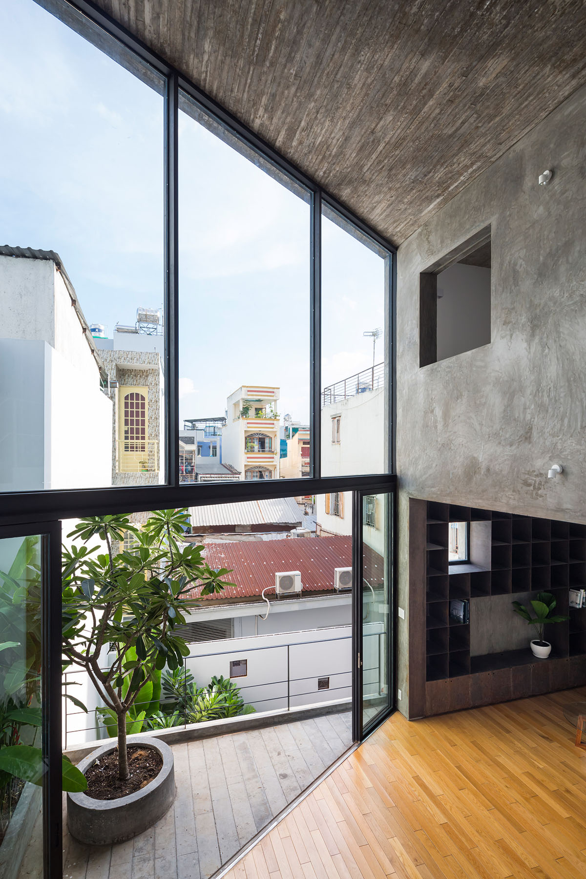 Sanuki Daisuke Architects' multifaceted concrete house features more open spaces in Vietnam