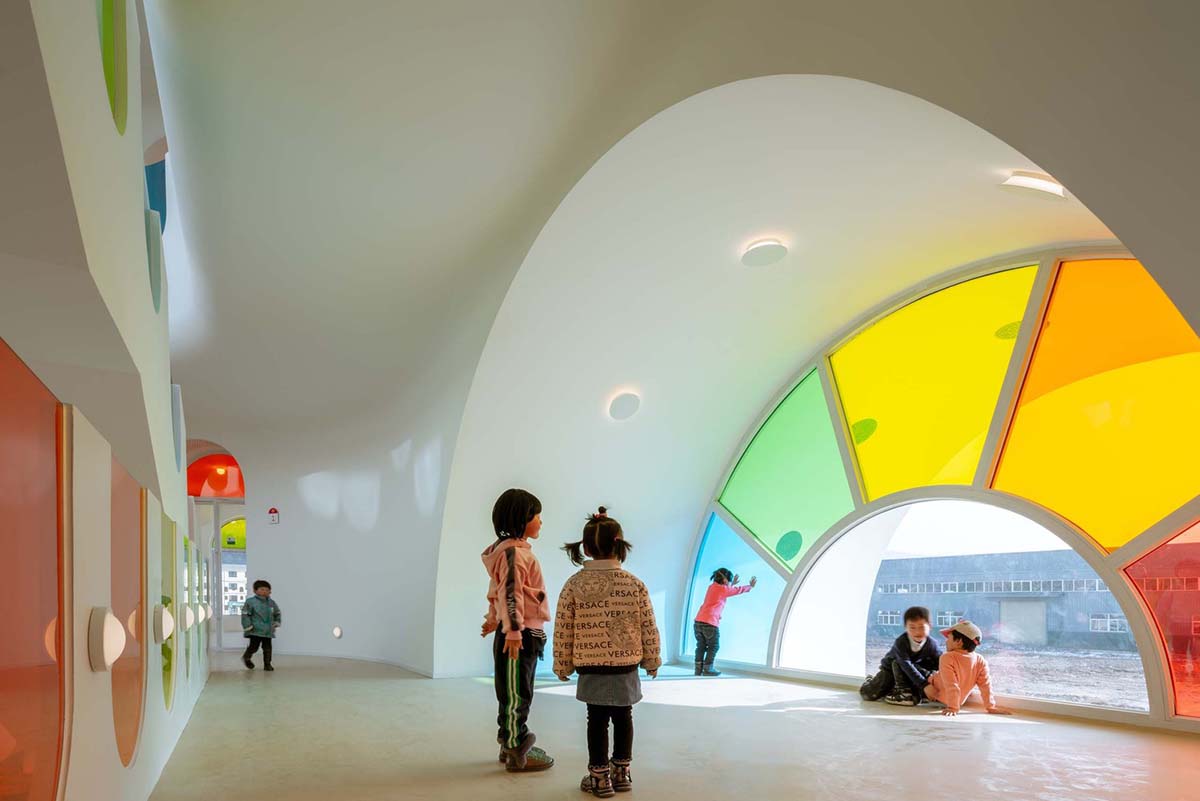 SAKO Architects designs colorful glass doors to evoke children's creativity in this school in China