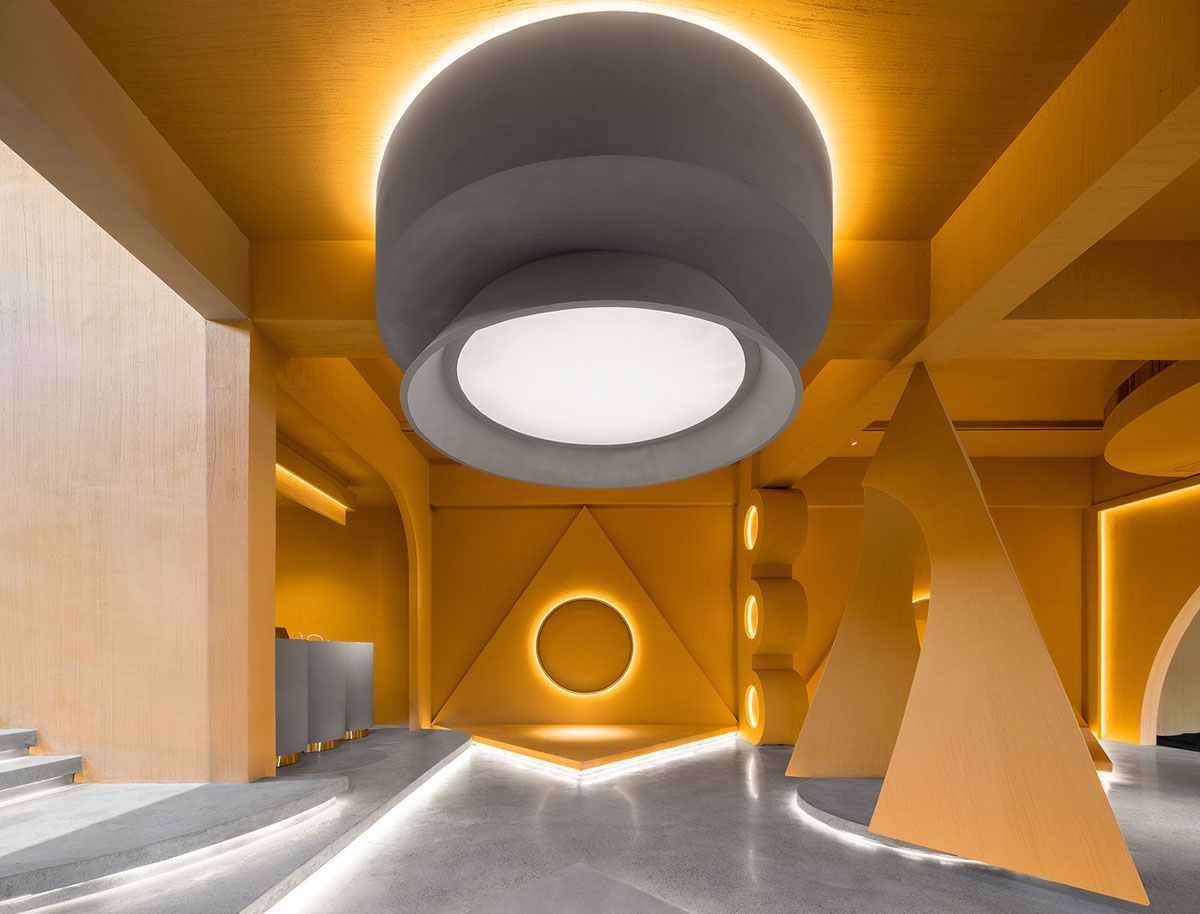 Angular corrugated stainless steel sheets form this showroom designed by PIG DESIGN in Hangzhou