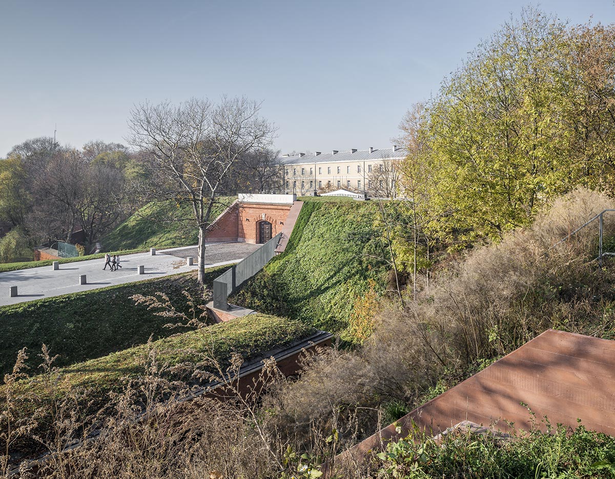 BBGK Architekci designed 12-metre-high stained concrete wall to narrate victims for Katyn Museum