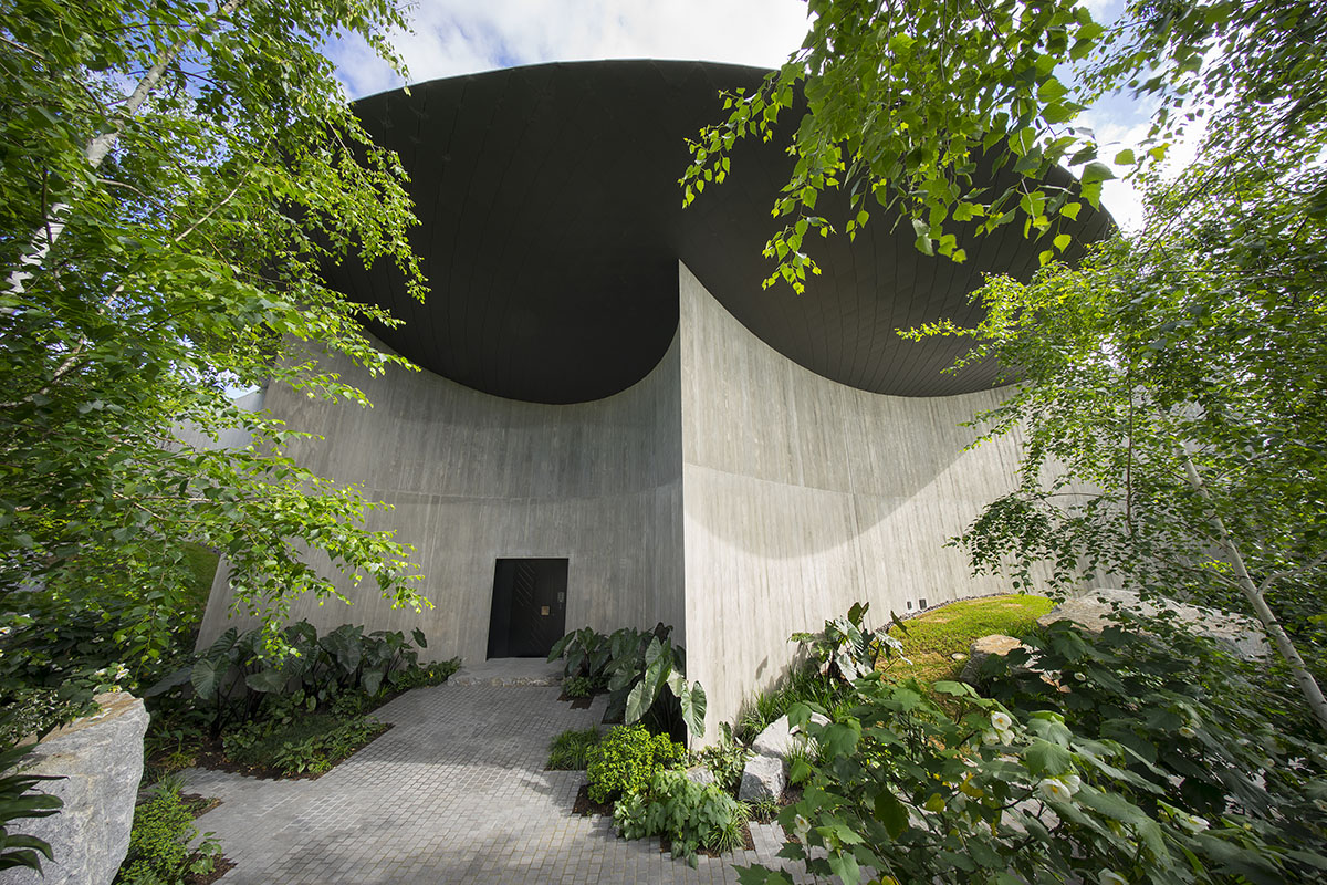 Wood Marsh built sculptural Towers Road House that features disc-shaped zinc roof in Toorak