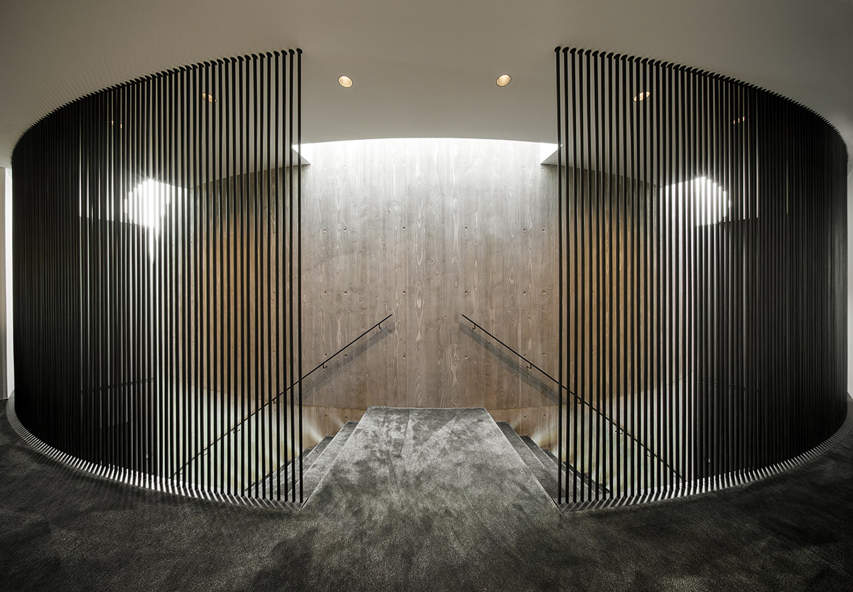 Wood Marsh built sculptural Towers Road House that features disc-shaped zinc roof in Toorak