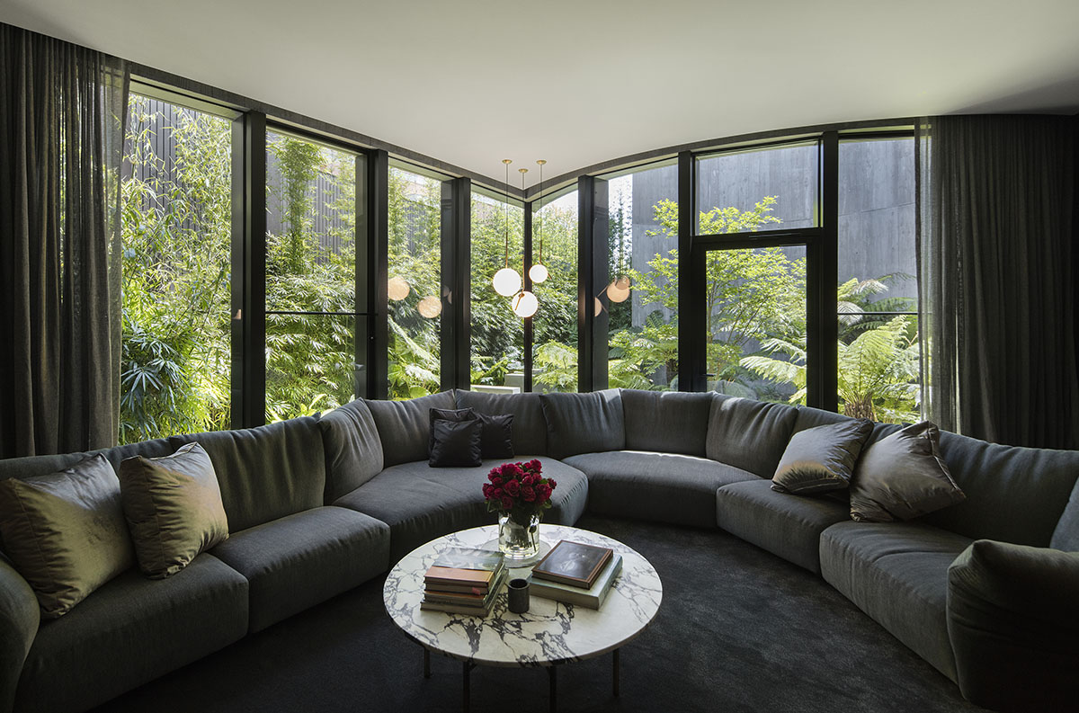 Wood Marsh built sculptural Towers Road House that features disc-shaped zinc roof in Toorak