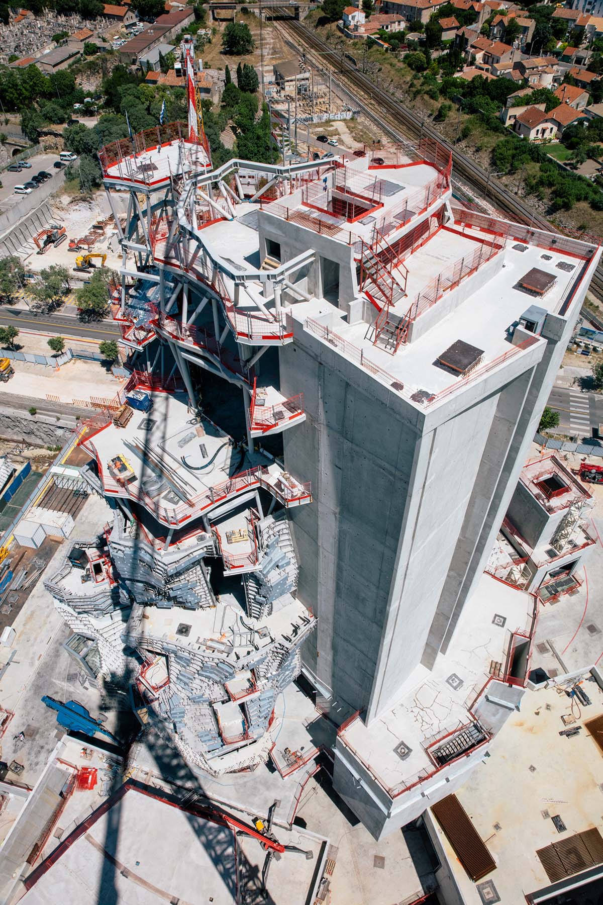 Construction photographs revealed for Frank Gehry’s mountainous stainless steel tower at LUMA Arles