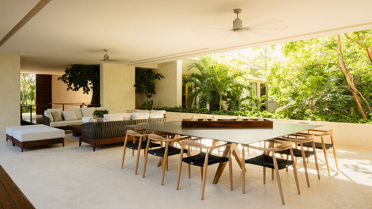 Sordo Madaleno Arquitectos' L-shaped residence disappears in a lush vegetation of Mexican island