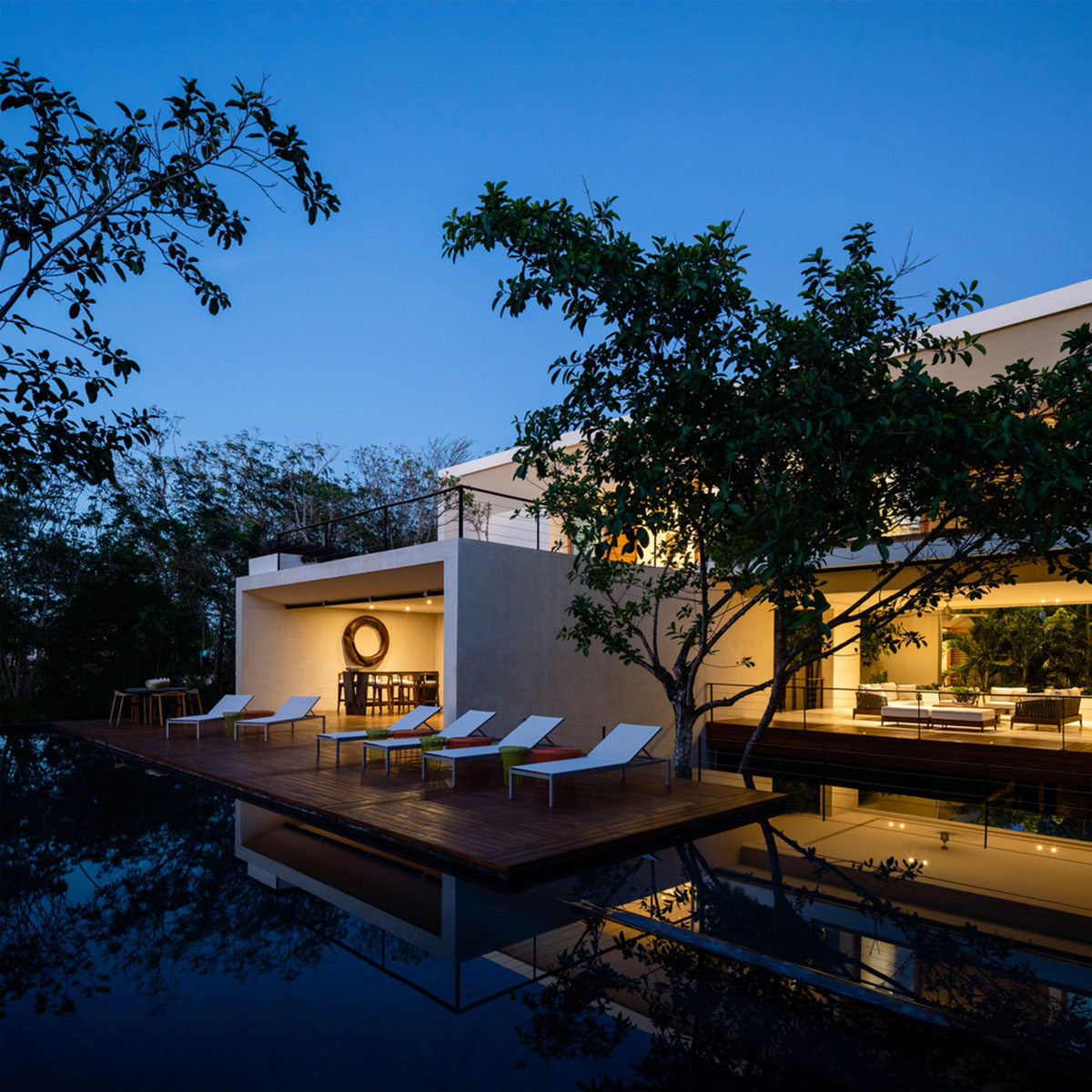 Sordo Madaleno Arquitectos' L-shaped residence disappears in a lush vegetation of Mexican island