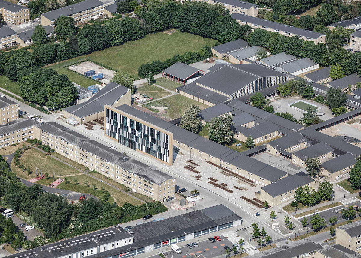 COBE's funnel-shaped Tingbjerg Library and Culture House acts like a single facade in Copenhagen