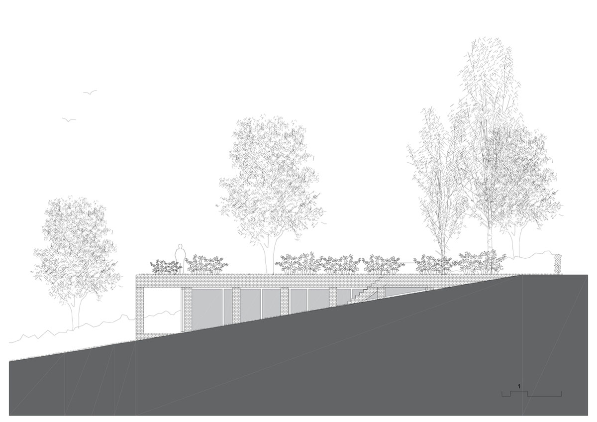 Studio Okami Architects built brick private villa embedded in the slope to offer infinite views