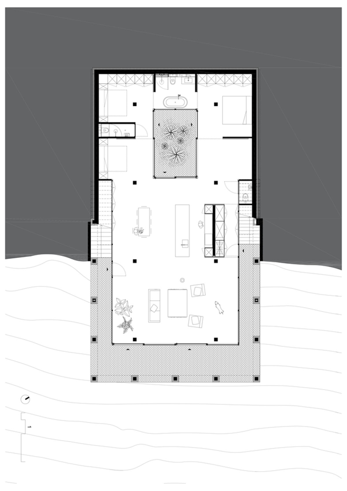 Studio Okami Architects built brick private villa embedded in the slope to offer infinite views