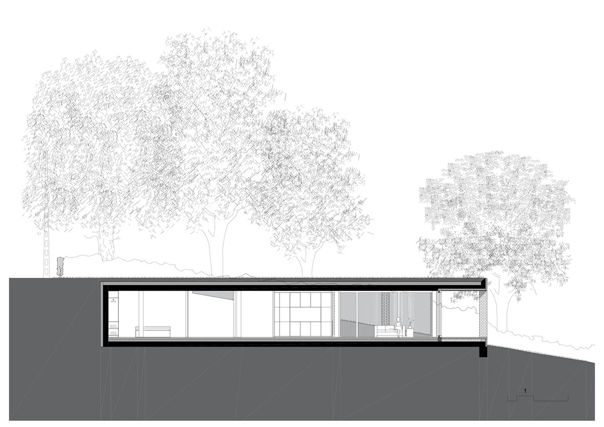 Studio Okami Architects built brick private villa embedded in the slope to offer infinite views