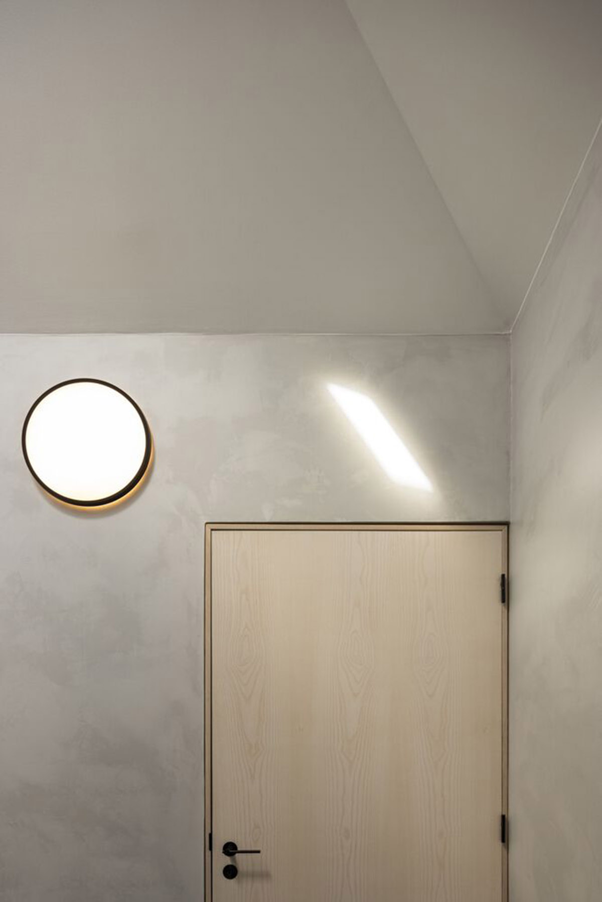 BOX arquitectos designs all-white narrow urban house featuring large terrace in Ponta Delgado 